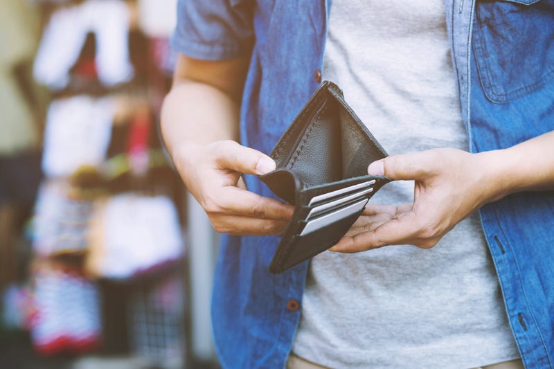man opens wallet