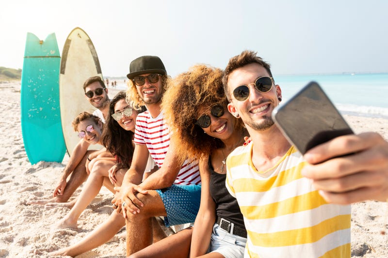 group wearing sunglasses at the beach