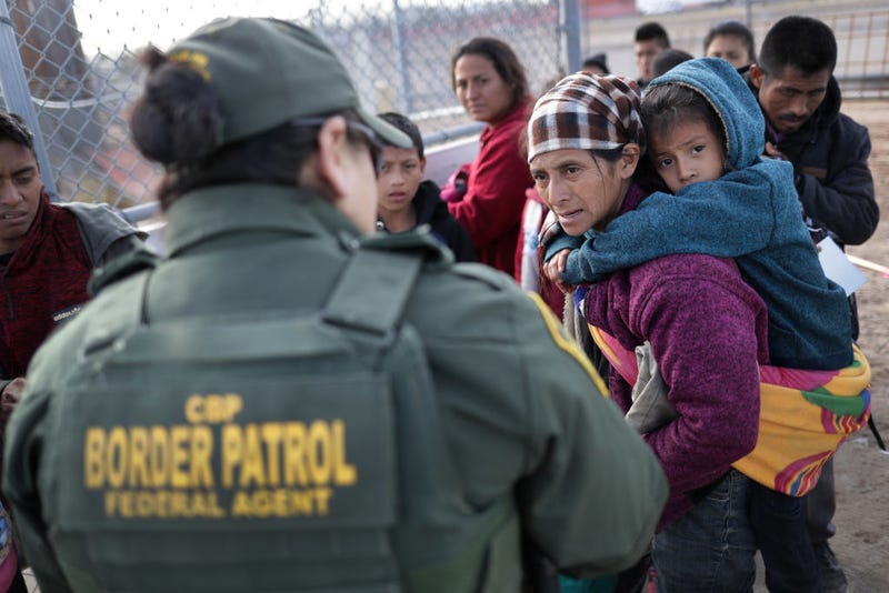 A U.S. Border Patrol agent takes Central American immigrants into custody after they crossed the U.S. Mexico border on February 01, 2019 in El Paso, Texas. The migrants, who said they were from Guatemala, turned themselves in to U.S. Border Patrol agents, seeking political asylum in the United States.