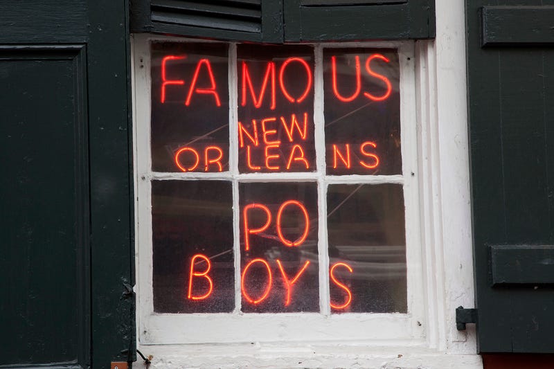 po boy neon sign in window new orleans louisiana