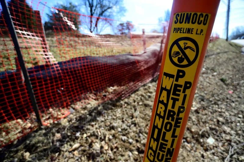 Warning sings mark the presence of a natural gas liquids pipeline