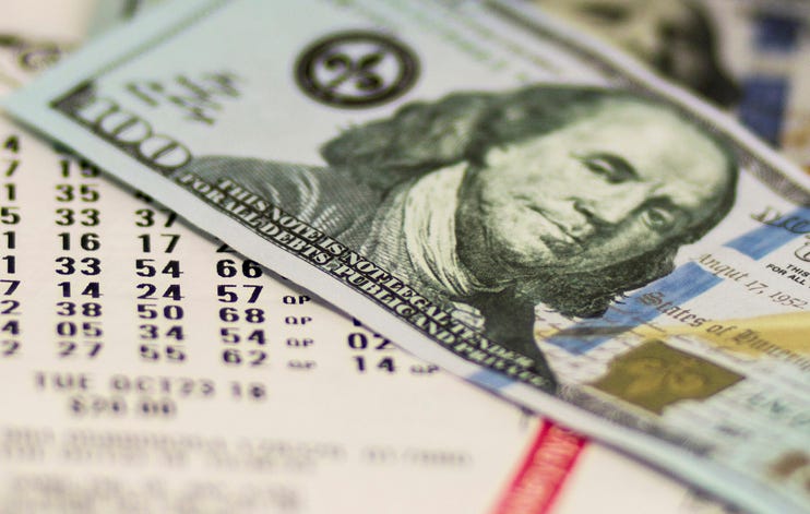 Lottery ticket and money.