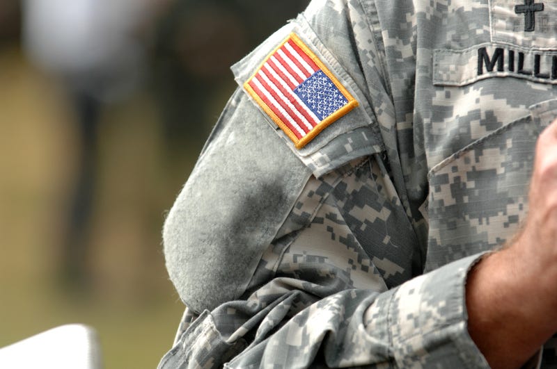 Soldier standing in a field.