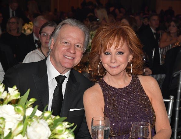 Skeeter Lasuzzo and host Reba McEntire attend Celebrity Fight Night