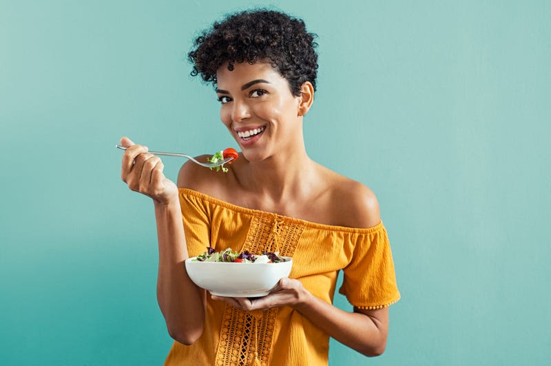 woman eats healthy whole30 meal