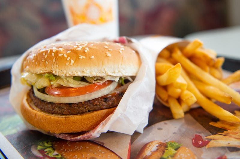 Diner enjoys a Burger King Impossible Whopper