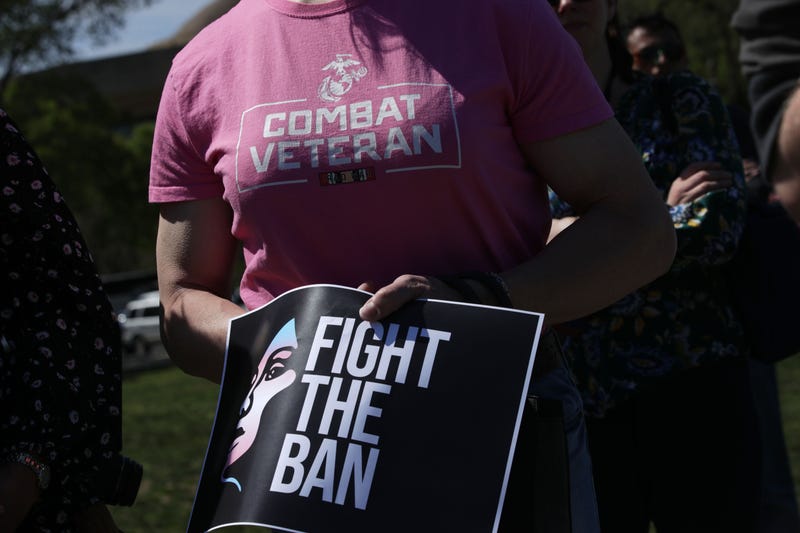 Activists participate in a rally at the Reflecting Pool of the U.S. Capitol April 10, 2019 in Washington, DC. Democratic lawmakers joined activists to rally against the transgender military service ban. (Photo by Alex Wong/Getty Images)