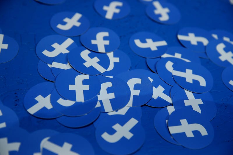 Paper circles with the Facebook logo.