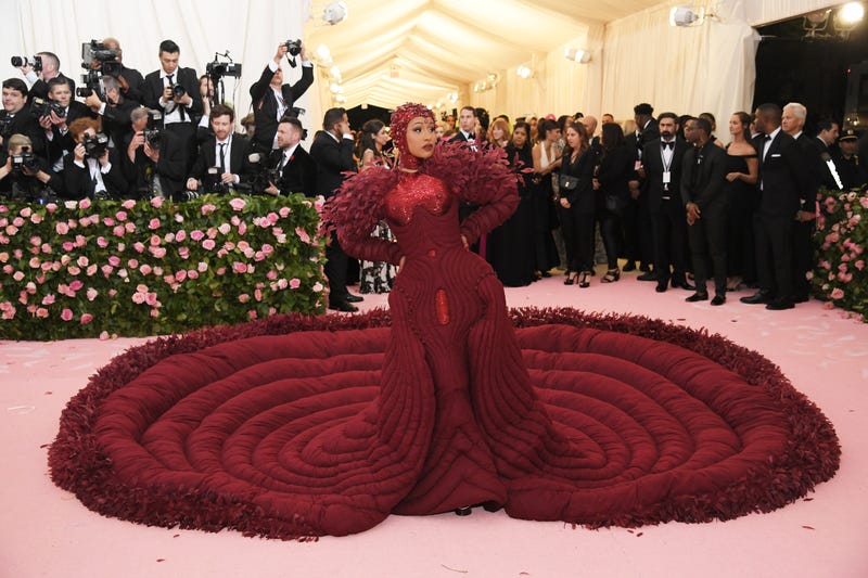 cardi b poses in her surreal futuristic red dress at the 2019 met gala
