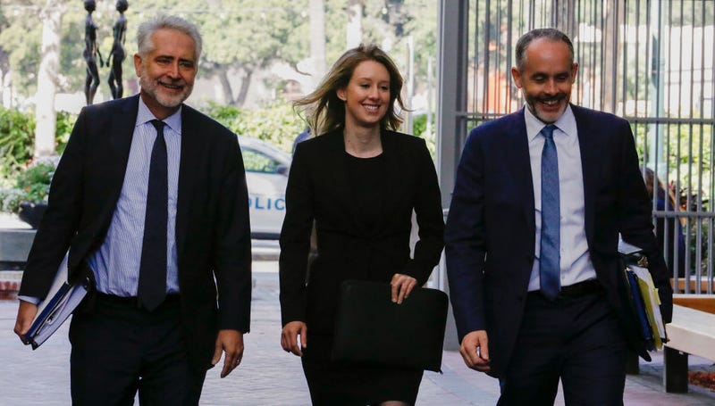 Former Theranos CEO Elizabeth Holmes (C) and lawyer Kevin Downey (L) appear in federal court for a status hearing on July 17, 2019 in San Jose, California.