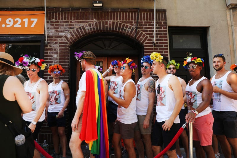People gather in front of the Stonewall Inn in celebration of Pride in NYC on June 28, 2019