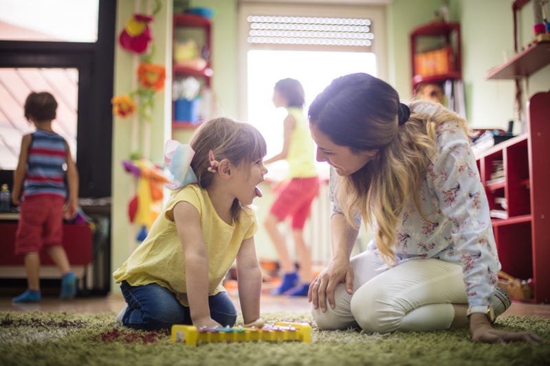 A mom plays with her daughter