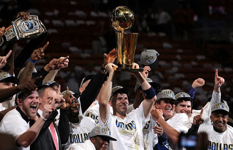 Jason Kidd #2 of the Dallas Mavericks holds the Larry O'Brien trophy after the Mavericks won 105-95 against the Miami Heat in Game Six of the 2011 NBA Finals at American Airlines Arena on June 12, 2011 in Miami, Florida.
