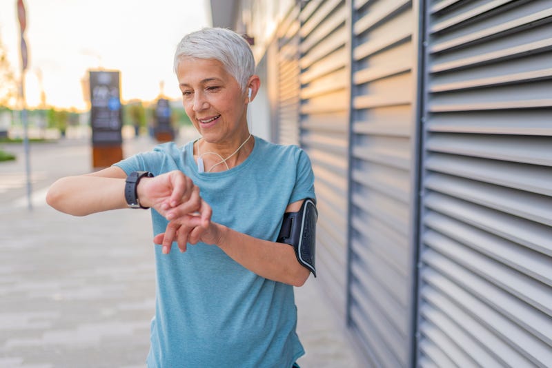Woman checking her fitbit.