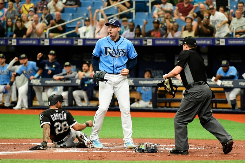 Blake Snell pumps his fist after making an out at home plate