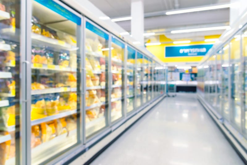 Frozen food freezers and shelves in the supermarket.