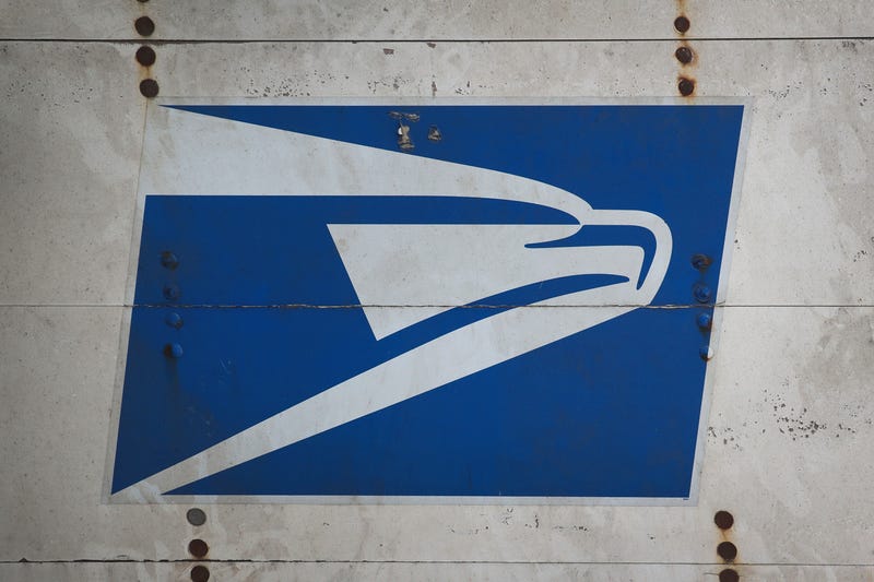 A United States Postal Service (USPS) logo is painted on the back of a truck on August 15, 2019 in Chicago, Illinois.