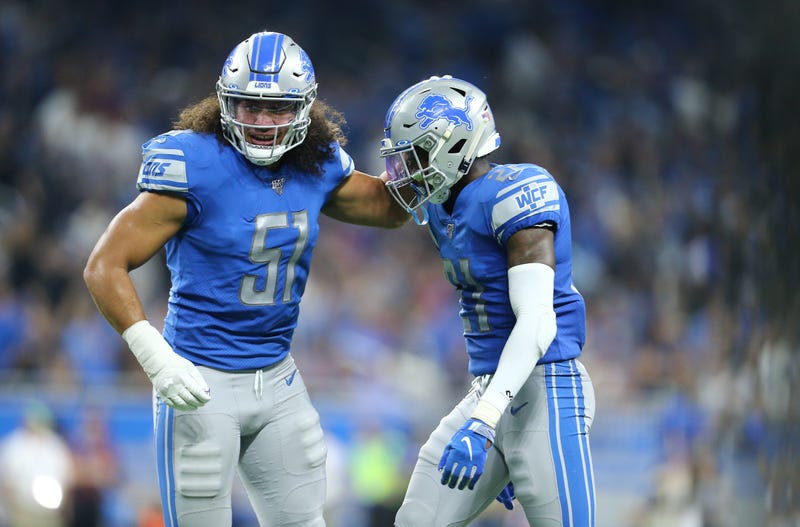 Jahlani Tavai (left) and Darius Slay (right) helped the Lions to upset the Chargers.