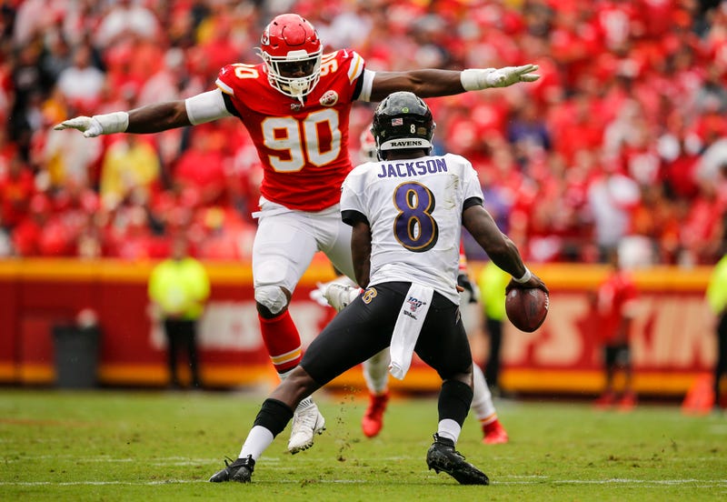 Emmanuel Ogbah lunges at Ravens quarterback Lamar Jackson
