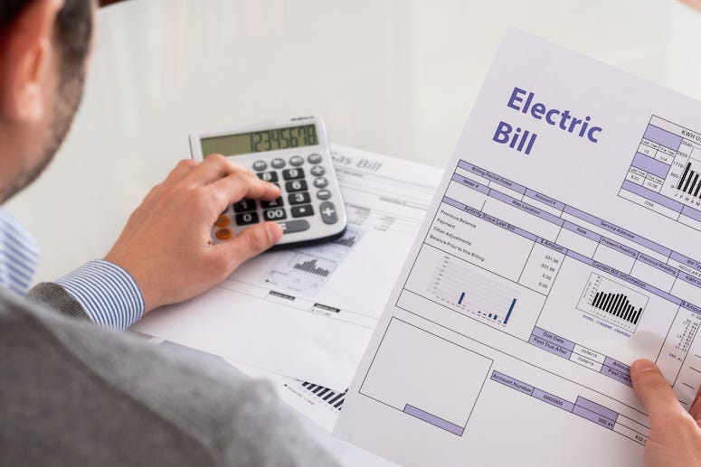 Man paying electric bill