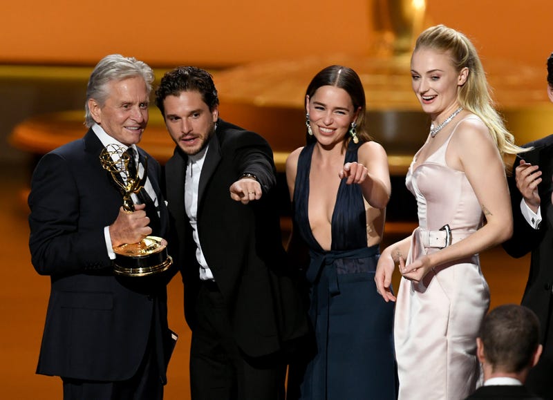 michael douglas presents outstanding drama series for game of thrones to kit harrington, emilia clarke and sophie turner