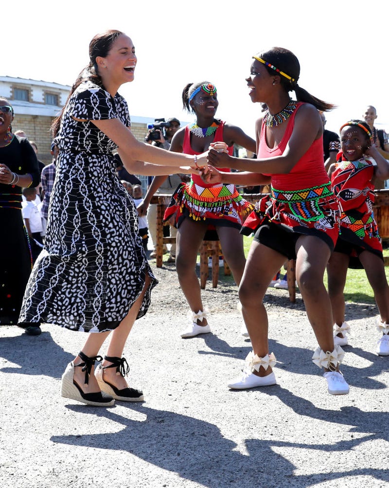 Meghan Markle is all smiles as she dances in South Africa.