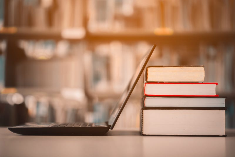 Laptop and books at college