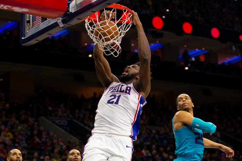 Joel Embiid attacks the rim with a two-handed jam