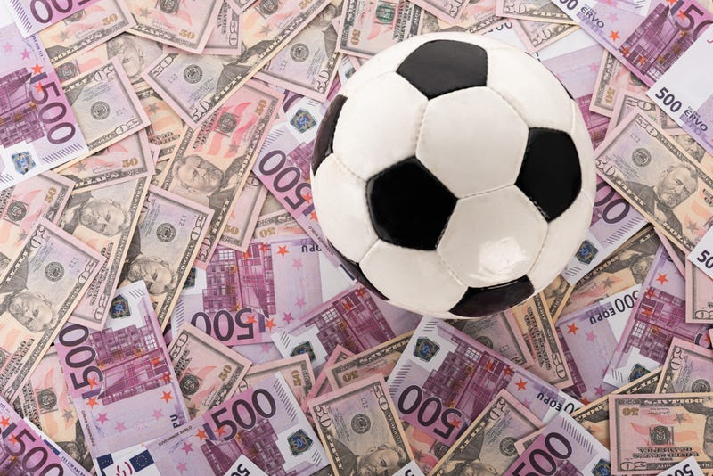 soccer ball and money
