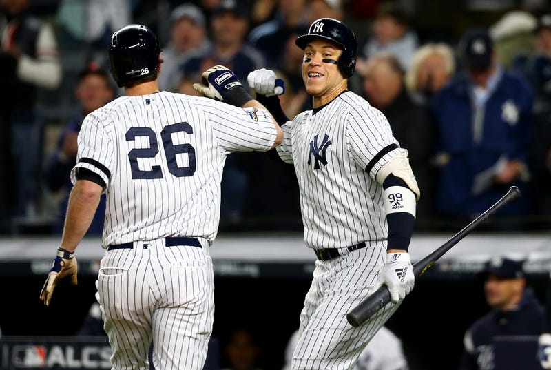DJ LeMahieu bumps fists with Aaron Judge