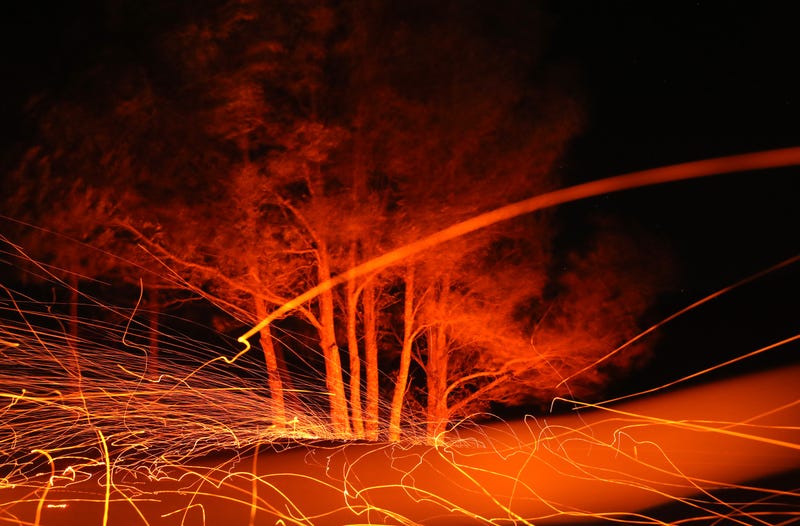 Embers fly as high winds blow hot spots from the Kincade Fire on October 29, 2019 in Calistoga, California.