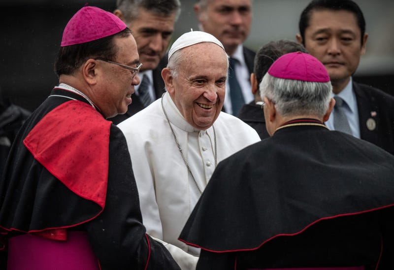 Pope Francis is bade farewell by senior Catholic clergy as he prepares to board his plane before leaving Japan