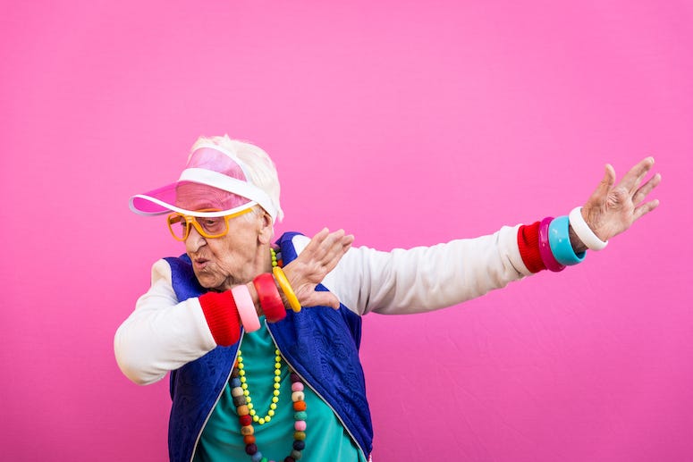 Grandmother wearing '80s outfit dabbing