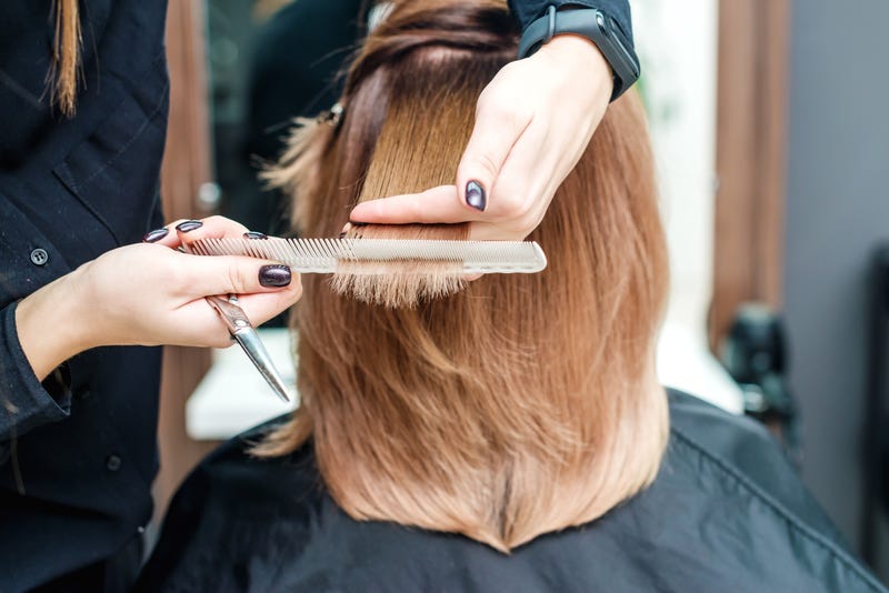 Hairstylist cutting hair