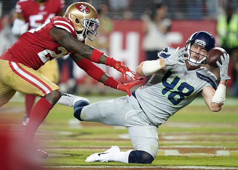Seahawks tight end Jacob Hollister beats a defender for the catch
