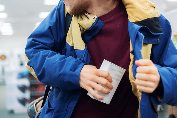 Man stealing item in store