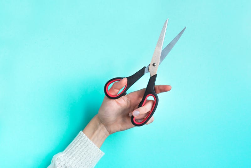 Hand with scissors stock photo.