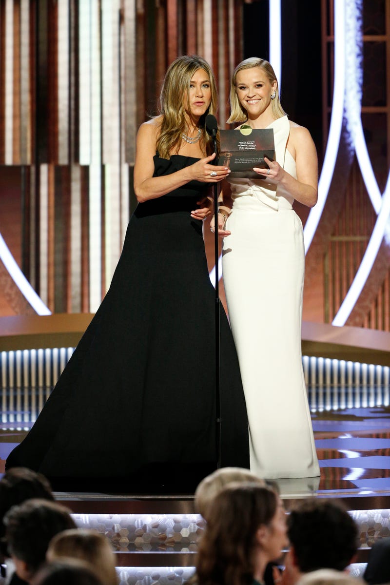 presenters Jennifer Aniston and Reese Witherspoon accept award on behalf of russell crowe
