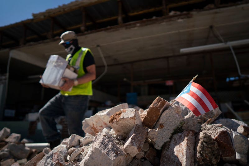 A Puerto Rican flag sits in a pile of rubble after a 6.4 earthquake hit just south of the island on January 7, 2020 in Guánica, Puerto Rico.