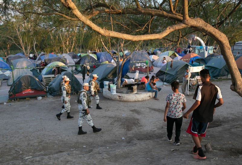 Mexican National Guard troops patrol through a camp for asylum seekers on December 08, 2019 in the border town of Matamoros, Mexico.
