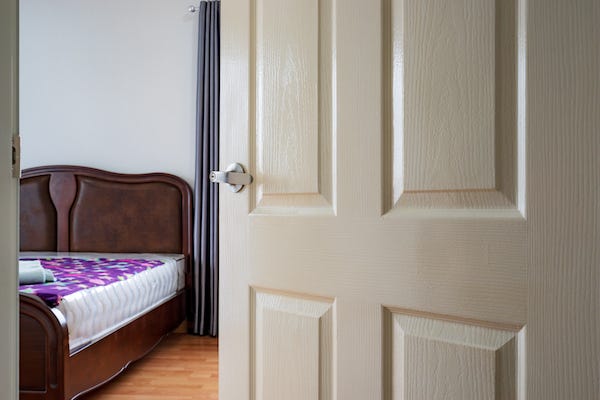 Open door to empty bedroom