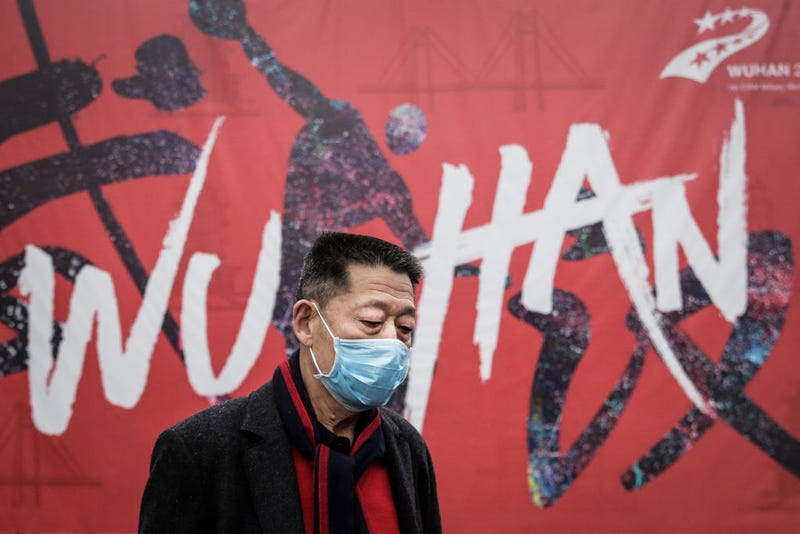 A man wears a mask while walking in the street on January 22, 2020 in Wuhan, Hubei province, China. A new infectious coronavirus known as "2019-nCoV" was discovered in Wuhan as the number of cases rose to over 400 in mainland China.