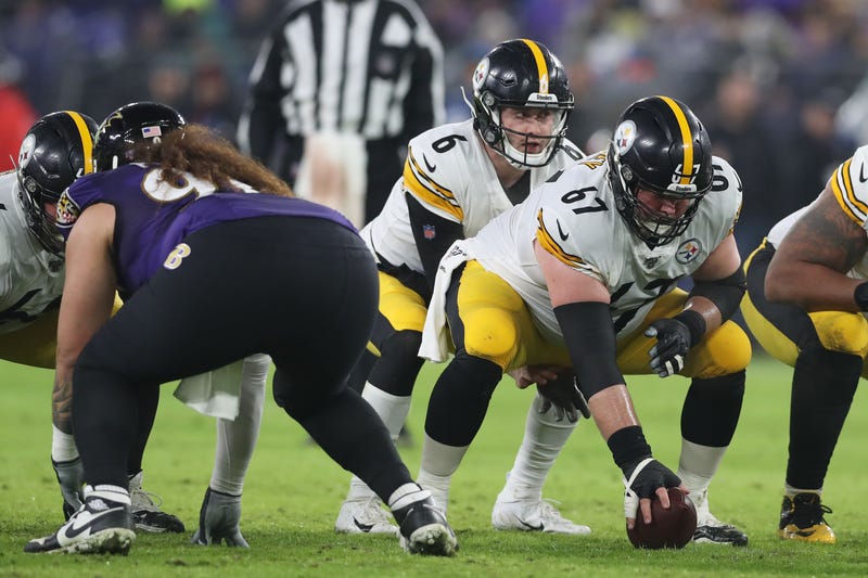 B.J. Finney snaps the ball to Steelers quarterback Devlin Hodges