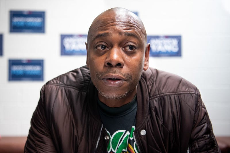Comedian Dave Chappelle talks with the media while campaigning for Democratic presidential candidate Andrew Yang on January 30, 2020 in North Charleston, South Carolina.