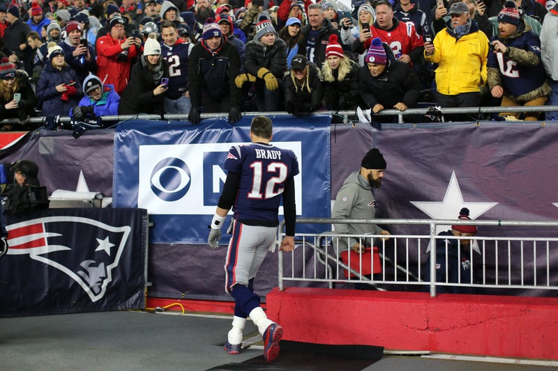 Tom Brady retreats to the Patriots' locker room at Gillette Stadium