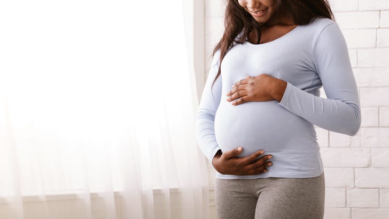A Black pregnant woman.
