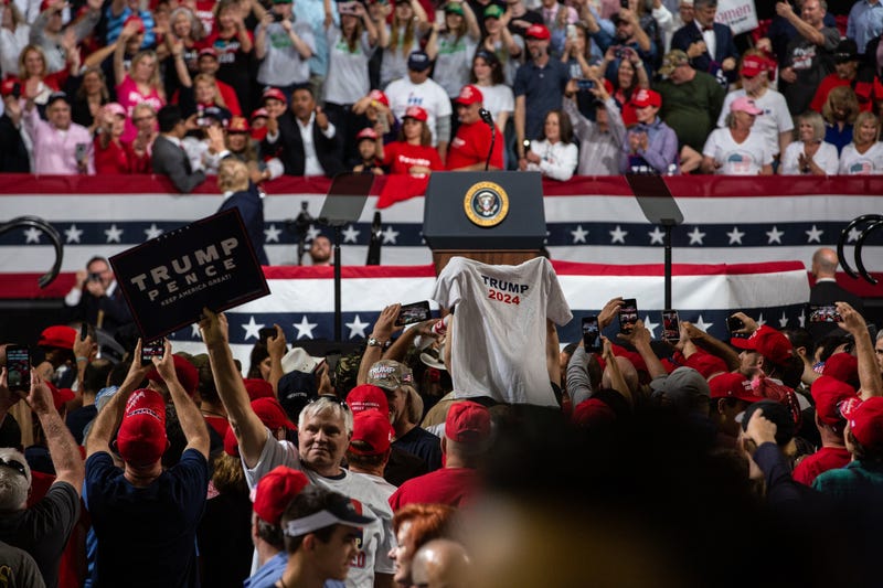 Supporters of President Donald Trump hold a shirt that says Trump 2024 at a rally in Arizona in February 2020.