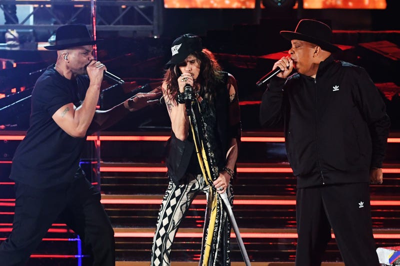 oseph Simmons of music group Run–D.M.C., Steven Tyler of music group Aerosmith, and Darryl McDaniels of music group Run–D.M.C. perform onstage during the 62nd Annual GRAMMY Awards