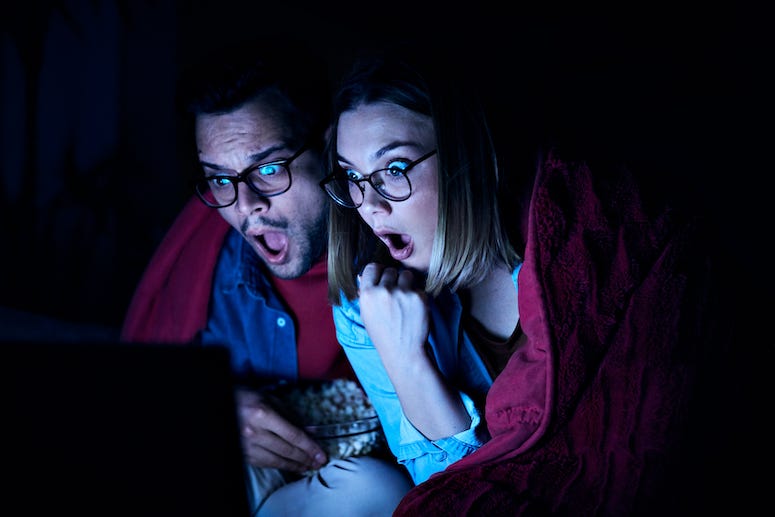 Couple watching videos in dark