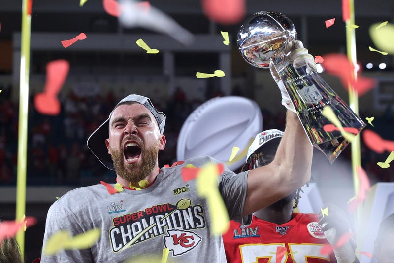 Travis Kelce hoists the Lombardi Trophy following the Chiefs' Super Bowl win over San Francisco